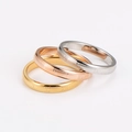 Detailed view of three stackable stainless steel rings with Roman numeral engravings - US Size 6