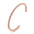 Macro shot of rose gold bead bracelet with polished surface and open cuff design - Beaded Bracelet / Rose Gold