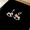 Macro view of 18K gold plated silver horse earrings in a black velvet jewelry box - Hoop Rocking Horse (17#)
