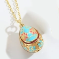 Sky blue Fabergé style egg pendant necklace with pink floral patterns on golden chain - Blue (XL3225 Blue)