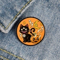 Close-up of Halloween ghost cat and pumpkin badge on blue denim fabric - Three-eyed Cat Pumpkin Ghost Moon Style (XZ6935)