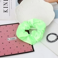 Neon green satin scrunchie with silk texture shown on a decorative tray - 14#-Neon Green