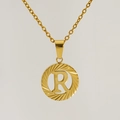 Detail of 18K gold plated stainless steel necklace featuring a letter R round pendant - Letter R