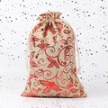 Christmas burlap gift bag with red foil holly leaf design and cream drawstring closure - Natural Linen Red Gold Christmas Holly