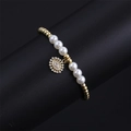 Detail of gold beads and white pearls bracelet with a sparkling Evil Eye charm - CB00224 Pearl/Pearl Gold Bead Round Eye