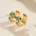 Detail of gold huggie earrings with alternating green and clear square-cut zircons - Green Zirconia C-Shape