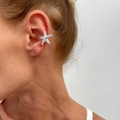 Detailed close-up of a silver starfish ear cuff worn on the upper cartilage of an ear - Textured Starfish (3553) / 1PC / Gold