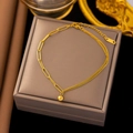 Elegant 18k gold plated bracelet with chunky link chain and small ball pendant on beige box - B86 Responsive