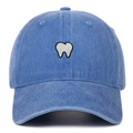 Vintage washed blue cotton baseball cap with white tooth embroidery on a white background - Light Blue