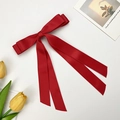 Elegant deep red satin bow hair clip with long ribbons on white background with tulips - Red