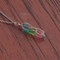 Detailed close-up of rainbow crystal pillar pendant wrapped in silver wire on wood - A-NSN0234 Steel Stainless Steel O-Chain