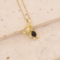 Detailed view of a gold bear pendant necklace with a black oval gemstone on stone base - Black Zircon Eye Bear (20#)