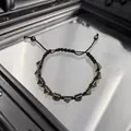 Gothic punk black braided bracelet featuring silver pyramid studs and adjustable pull cord - Hematite Pyramid Block Braided Bracelet (B042 D3-F3)
