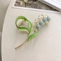 Elegante fermaglio per capelli mughetto con fiori blu e perle su base in metallo dorato - Blu