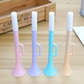 Set of four colorful plastic toy trumpets in pink, purple, blue, and beige colors - Trumpet Shape