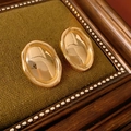 Macro detail of vintage gold oval stud earring displayed on a dark green knit frame - Style 39 S925 Silver Needle - 18K Gold Plated Pleated Oval