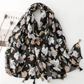 Floral cotton linen scarf with black base and tassels displayed with magazine and dried flowers - Black Base White & Brown Floral Pattern (SL2409-021)