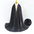 Solid black pearl chiffon scarf for women shown on a professional gold mannequin stand - Black