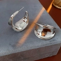 Polished silver wide C-shape earring displayed on grey velvet jewelry tray with sunlight - Thickened C-Shape Geometric Style / Silver