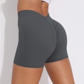 Close-up of high-waisted scrunch yoga shorts in dark grey with flattering V-waist design - Dark Gray