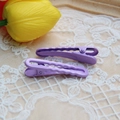 Detail of two wavy purple macaron hair clips on white lace with yellow tulips background - 1.2x4.9cm / Purple-Wave