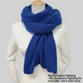 Royal blue chunky knit winter scarf with ribbed texture shown on a female mannequin - Klein Blue