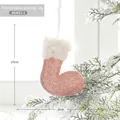 Pink sequin Christmas stocking ornament with faux fur trim hanging on snowy tree - Pink Small Christmas Stocking