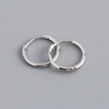Macro detail of polished s925 sterling silver hoop earrings with secure clasp closure - 11mm Inner Diameter (Platinum Color)