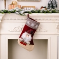 Large Christmas stocking with 3D Santa Claus and snowflake pattern hanging on mantel - Red Santa Claus Style