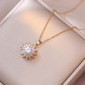 Elegant rotating sunflower pendant necklace with zircon petals on golden steel chain - Rotating Sunflower Necklace