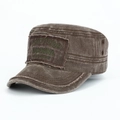 Close-up of vintage brown cadet cap with survivor embroidery and raw edges on washed cotton - Coffee
