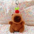 Brown Capybara plush keychain with red fruit decor and silver metal lobster clasp - Dark Brown Apple + Silver Clip