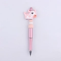 Detailed close-up of a pink beaded ballpoint pen featuring a cute silicone cow topper - Light Pink Cow