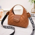 Compact brown quilted mini handbag with decorative S-logo and wide patterned shoulder strap - Brown