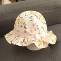 Beige floral baby sun hat with colorful flower patterns and a white side bow detail - Pink