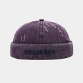 Détail du bonnet docker violet avec broderie Progress et finitions délavées vintage - Réglable / Violet