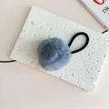 Close-up of fluffy grey faux fur pom pom hair tie with black high-elastic rubber band - Sky Blue
