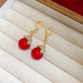 Macro detail of gold snake earrings with red beads and green crystals in jewelry box - 11# Red Snake Winding Round Ball Ear Buckle