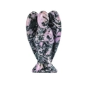 Pink and black rhodonite gemstone angel figurine with natural stone textures - Rhodochrosite