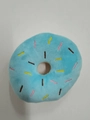 Detail of a blue plush donut pet toy with colorful embroidered stripes on white background - Blue Donut