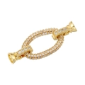 Detailed macro view of an 18K gold plated oval jewelry clasp set with white cubic zirconia - Gold (VK229 Large Pig Nose)