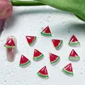Close-up of resin watermelon nail art charms with vibrant red seeds and green crust - 05 Watermelon