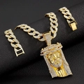 Detailed view of gold Cuban link necklace and bracelet set with iced out Jesus pendant - 20-inch Cuban Chain Set / Gold