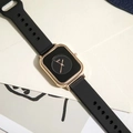 Close-up of minimalist square gold quartz watch with black dial and silicone strap - Black (Gold Case)