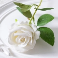 Single white artificial velvet rose with green leaves on an embossed white ceramic plate - 7cm / White (Velvet)