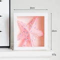 White square shadow box with pink glitter star ornament and colorful sprinkles decor - Pink Tree Topper Star