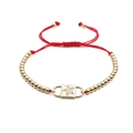 Verstellbares rotes Seilarmband mit goldenem Sternanhänger und Zirkonia Perlen - Stern / Gold/Rot