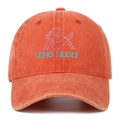 Close-up of rust orange baseball cap featuring vintage embroidery and cotton texture - Orange