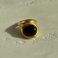Vintage 18k gold plated titanium ring with oval black stone on stone background - Gold Black Stone