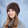 Dark brown chunky knit beanie hat for winter warmth shown on a female model - Coffee